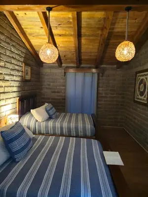 Cama o camas de una habitación en Cabaña el rio Rincon Verde