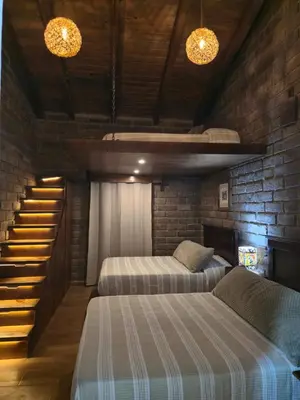 Cama o camas de una habitación en Cabaña el rio la tranquilidad