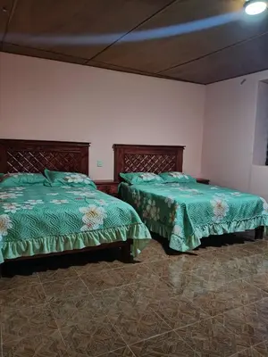 Cama o camas de una habitación en Hospedaje Santa Rita