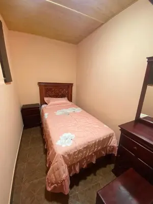 Cama o camas de una habitación en Hospedaje Santa Rita