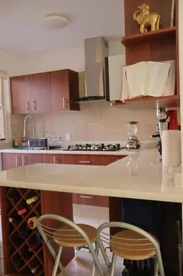 Una cocina o zona de cocina en CASA DE DESCANSO CON ALBERCa