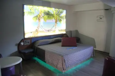 Cama o camas de una habitación en Hotel Puerto Angel