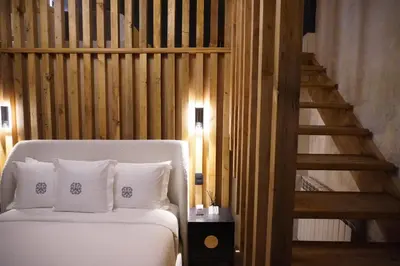 Cama o camas de una habitación en Por los Siglos de los Siglos Hotel