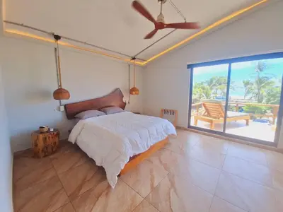 Cama o camas de una habitación en Espectacular Suite Frente a Playa Zicatela 1BDR