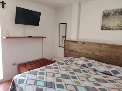 Cama o camas de una habitación en Cuatro Rumbos Hospedaje