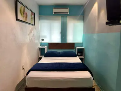 Cama o camas de una habitación en Brisa Marina Suites -A pasos del Acuario, Malecon y Playa