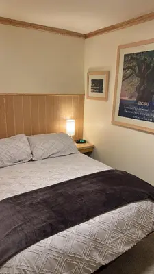 Cama o camas de una habitación en Casa del Bosque - Hermosa y Cálida Cabaña en Huitzilac - 22 huéspedes