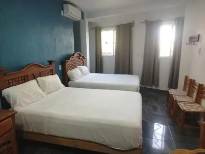 Cama o camas de una habitación en Casa Blanca Puerto Marqués 6