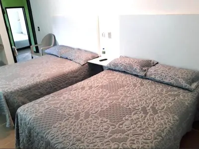 Cama o camas de una habitación en Hotel Entre Amigos Oaxaca Centro