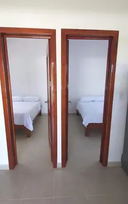 Cama o camas de una habitación en Villa Cristina en Villas Camino Real cerca de las dunas de Chachalacas