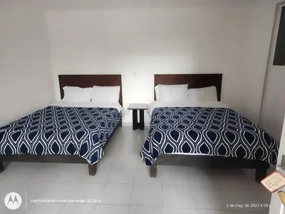 Cama o camas de una habitación en Hotel Los Ajolotes