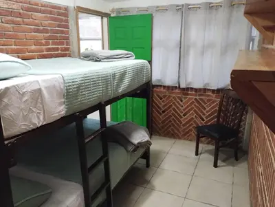 Cama o camas de una habitación en Xaltepic tú casa