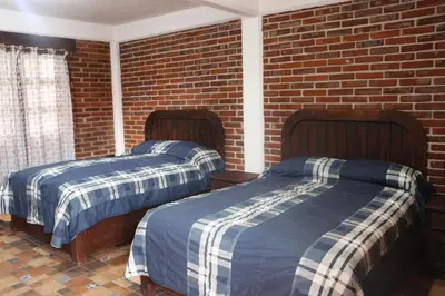Cama o camas de una habitación en Hotel Campestre El Rinconcito de Chigna