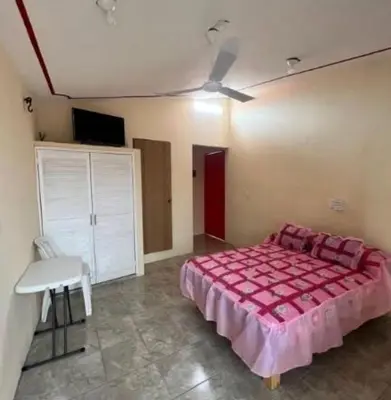Cama o camas de una habitación en Hostal Color Inn