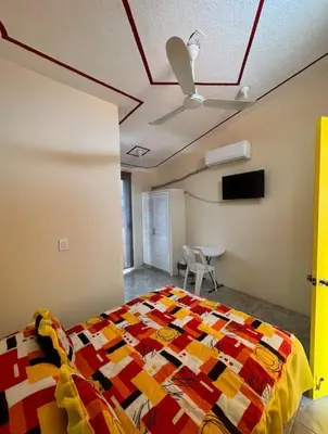 Cama o camas de una habitación en Hostal Color Inn