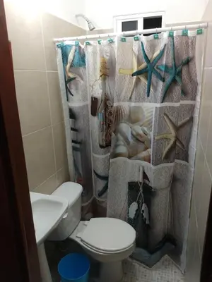Un baño de Villa Agustina en Villas Camino Real cerca de las dunas de Chachalacas