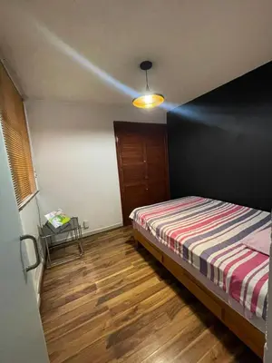 Cama o camas de una habitación en Departamento comodo y centrico en Portales