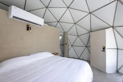 Cama o camas de una habitación en Mar de Barra Glamping