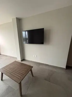 Una televisión o centro de entretenimiento en Increíble departamento con vista al mar
