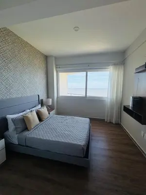 Una televisión o centro de entretenimiento en Increíble departamento con vista al mar