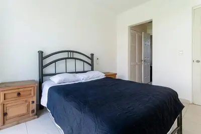 Cama o camas de una habitación en Puerta Laguna E002