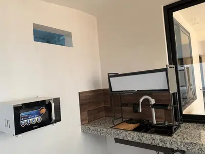 Una cocina o zona de cocina en Suite La Lomita #3 Climatizada