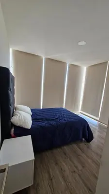 Cama o camas de una habitación en Departamento en Angelópolis