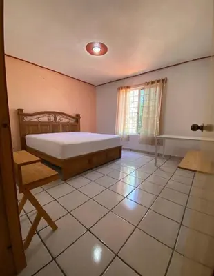 Cama o camas de una habitación en Casa Reforma Descanso y Bienestar en Oaxaca
