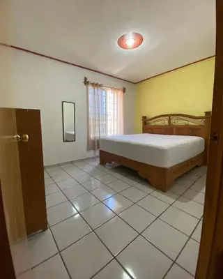 Cama o camas de una habitación en Casa Reforma Descanso y Bienestar en Oaxaca