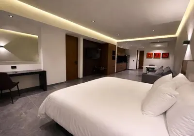 Cama o camas de una habitación en Hotel Suites Regente Cholula