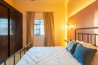 Cama o camas de una habitación en Casa céntrica con 4 habitaciones y estacionamiento