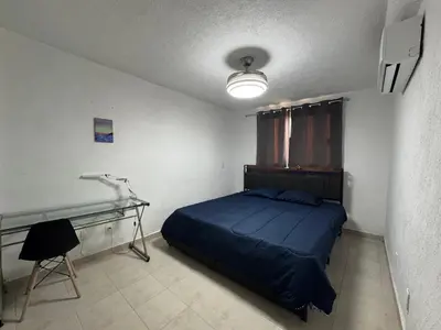 Cama o camas de una habitación en Departamento en Marina Diamante Rooftop y Jacuzzi privado
