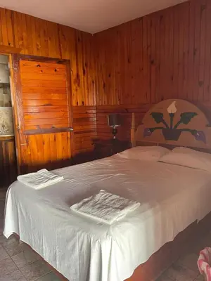 Cama o camas de una habitación en Hotel Paraiso del Pescador