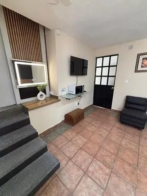 Una televisión o centro de entretenimiento en 3 Acogedor apartamento en el corazón de Atlixco