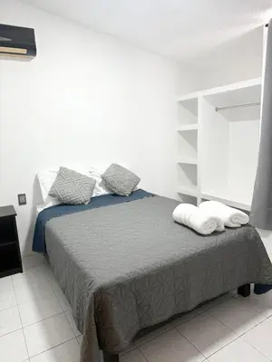 Cama o camas de una habitación en Casa Azul Guelaguetza