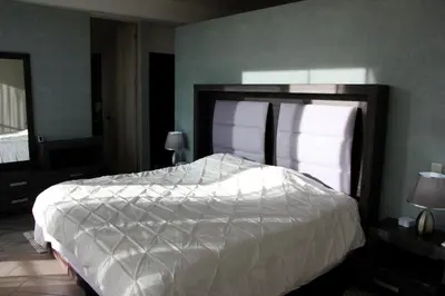 Cama o camas de una habitación en Penthouse with Glass Floor and Volcano View