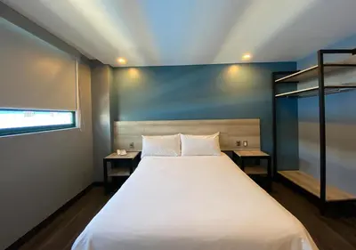Cama o camas de una habitación en Hotel Estrella de Oriente