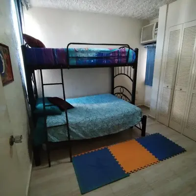 Cama o camas de una habitación en Departamento en Condominio Rocasol