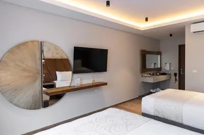 Una televisión o centro de entretenimiento en Hotel Boutique Alma