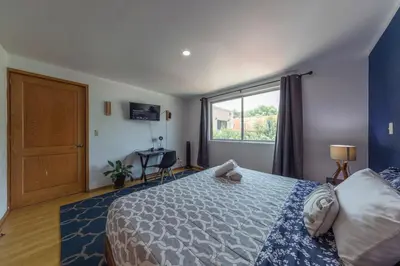 Cama o camas de una habitación en Casa Hidalgo By Mi Querido Coyoacán