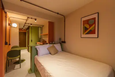 Cama o camas de una habitación en Nico Hotel & Residences