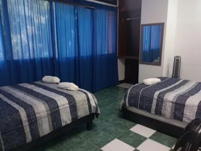 Cama o camas de una habitación en Departamentos Arista