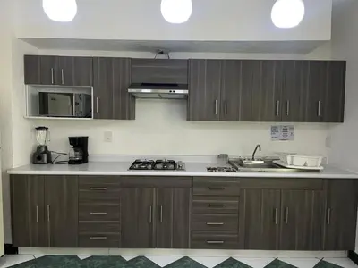 Una cocina o zona de cocina en Departamentos Arista