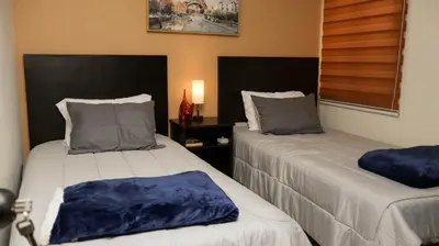 Cama o camas de una habitación en Pintoresca y Acogedora Casita Pueblo Mágico