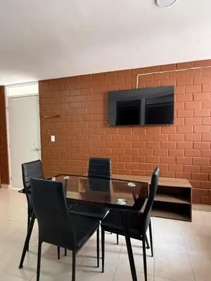 Una televisión o centro de entretenimiento en Departamento Villas Doradas