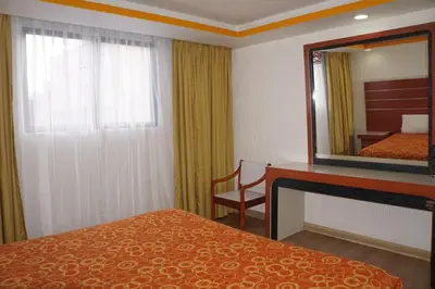 Cama o camas de una habitación en Hotel Puente