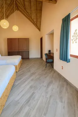 Cama o camas de una habitación en Bambu Villas Wellness Center