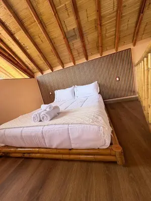 Cama o camas de una habitación en Bambu Villas Wellness Center
