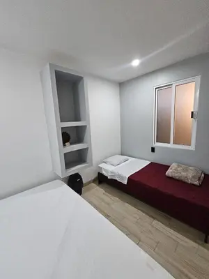 Cama o camas de una habitación en Hospedaje La Escondida
