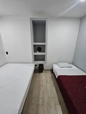Cama o camas de una habitación en Hospedaje La Escondida
